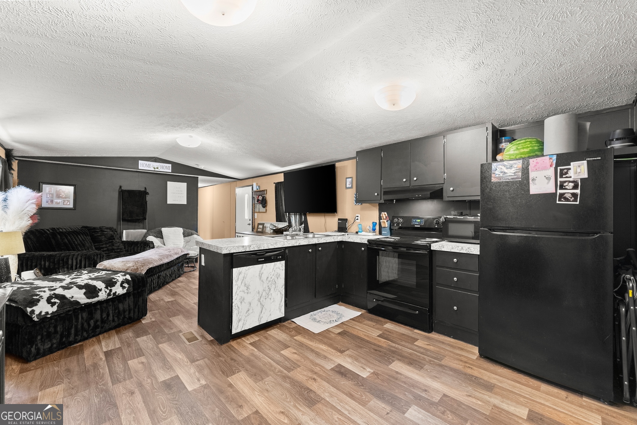 303 Blakely Chappelear Road Martin, GA 30557 - Photo 5 of 20 a kitchen with a refrigerator and a stove top oven