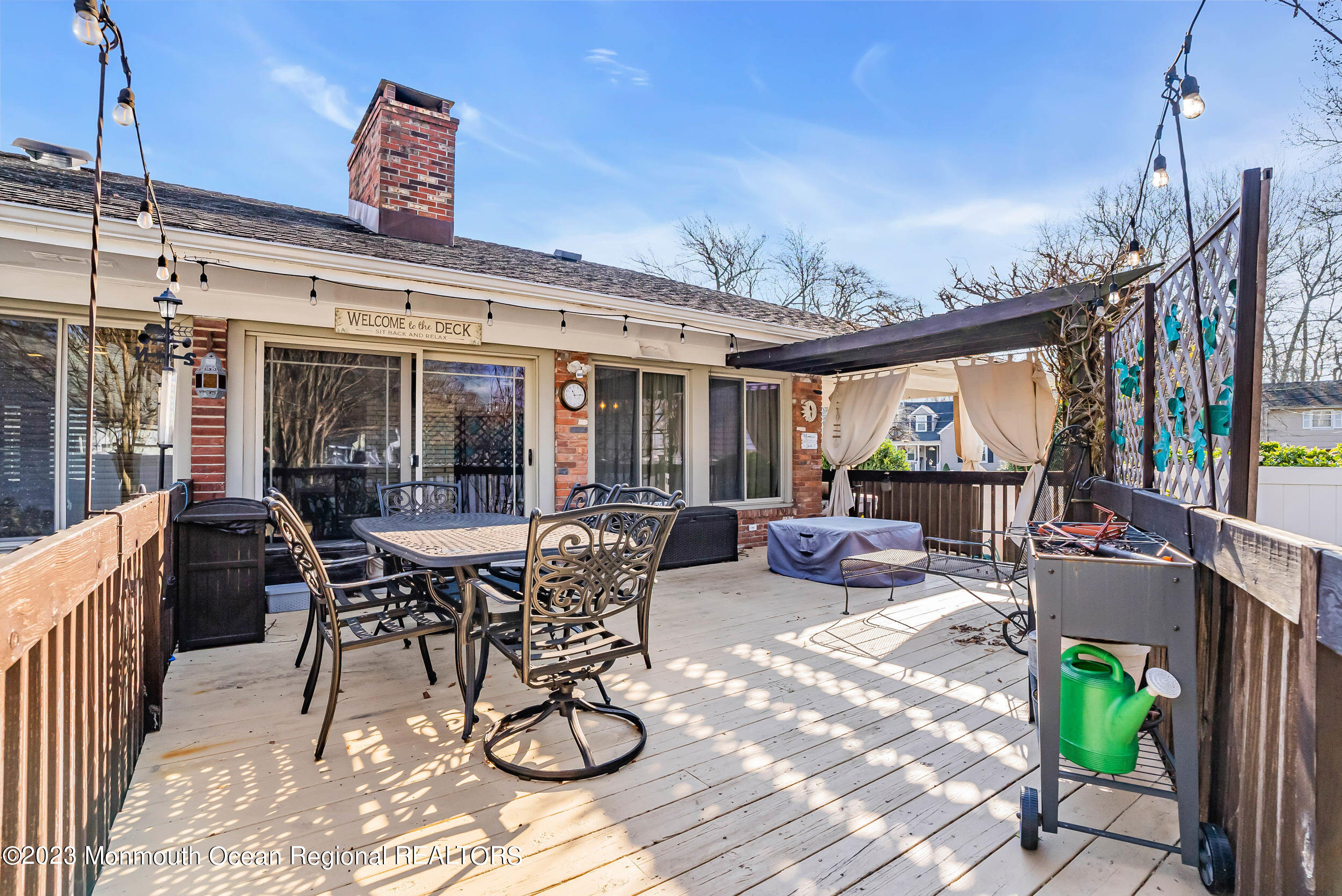 250 Cliftwood Road Oakhurst, NJ 07755 - Photo 18 of 40 a view of a dinning table and chairs in patio