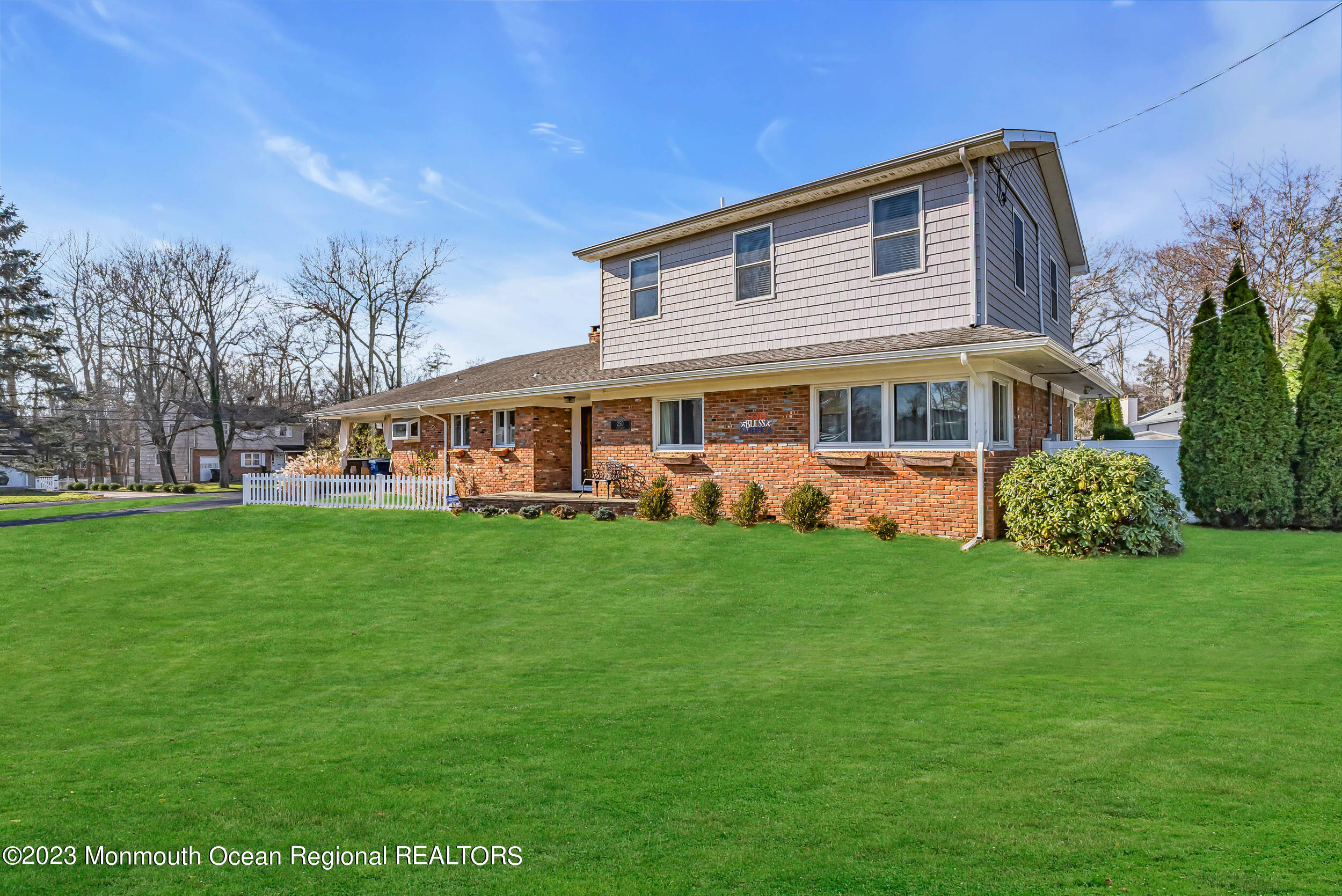 250 Cliftwood Road Oakhurst, NJ 07755 - Photo 22 of 40 a front view of a house with a garden