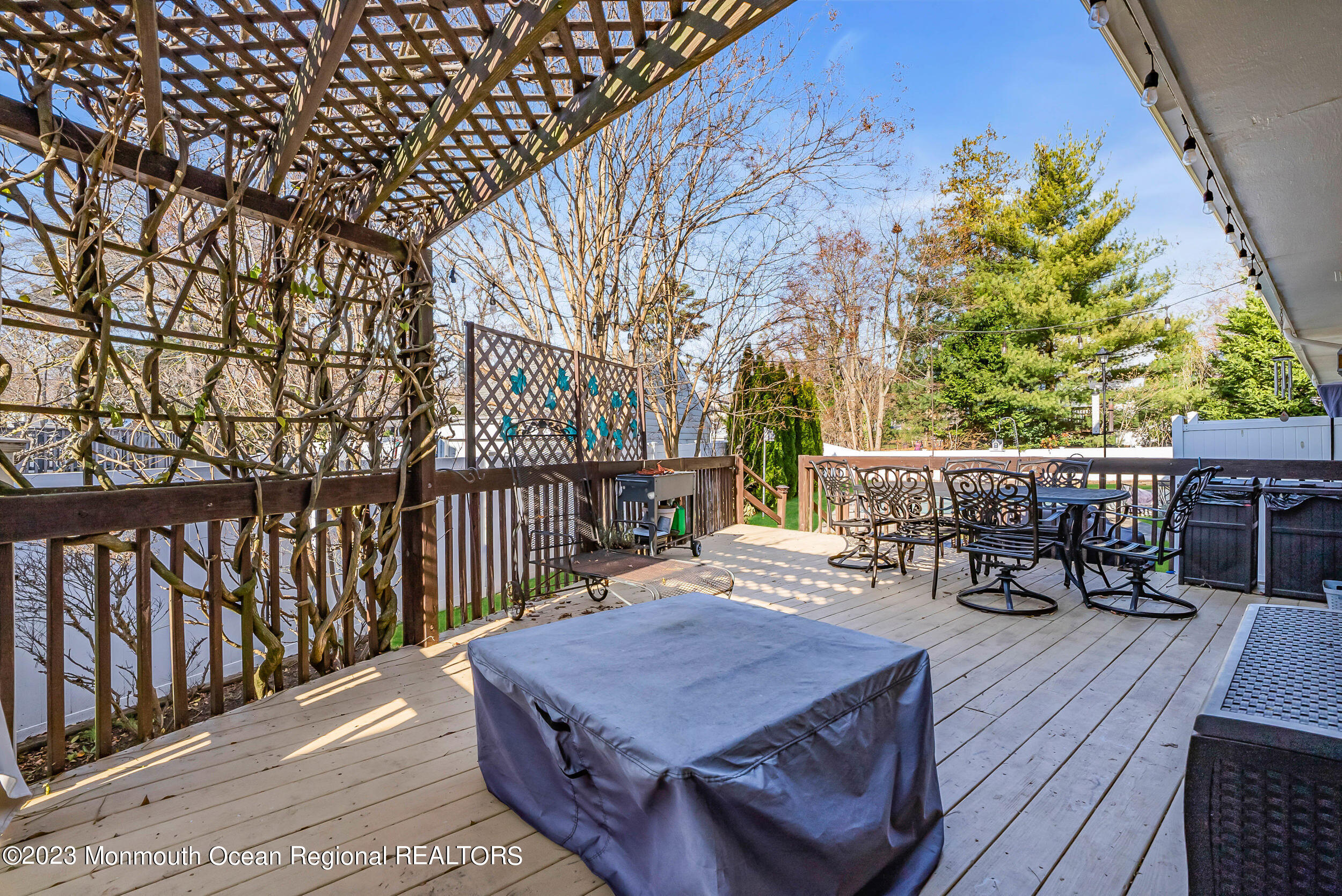 250 Cliftwood Road Oakhurst, NJ 07755 - Photo 38 of 40 a balcony with furniture and wooden floor