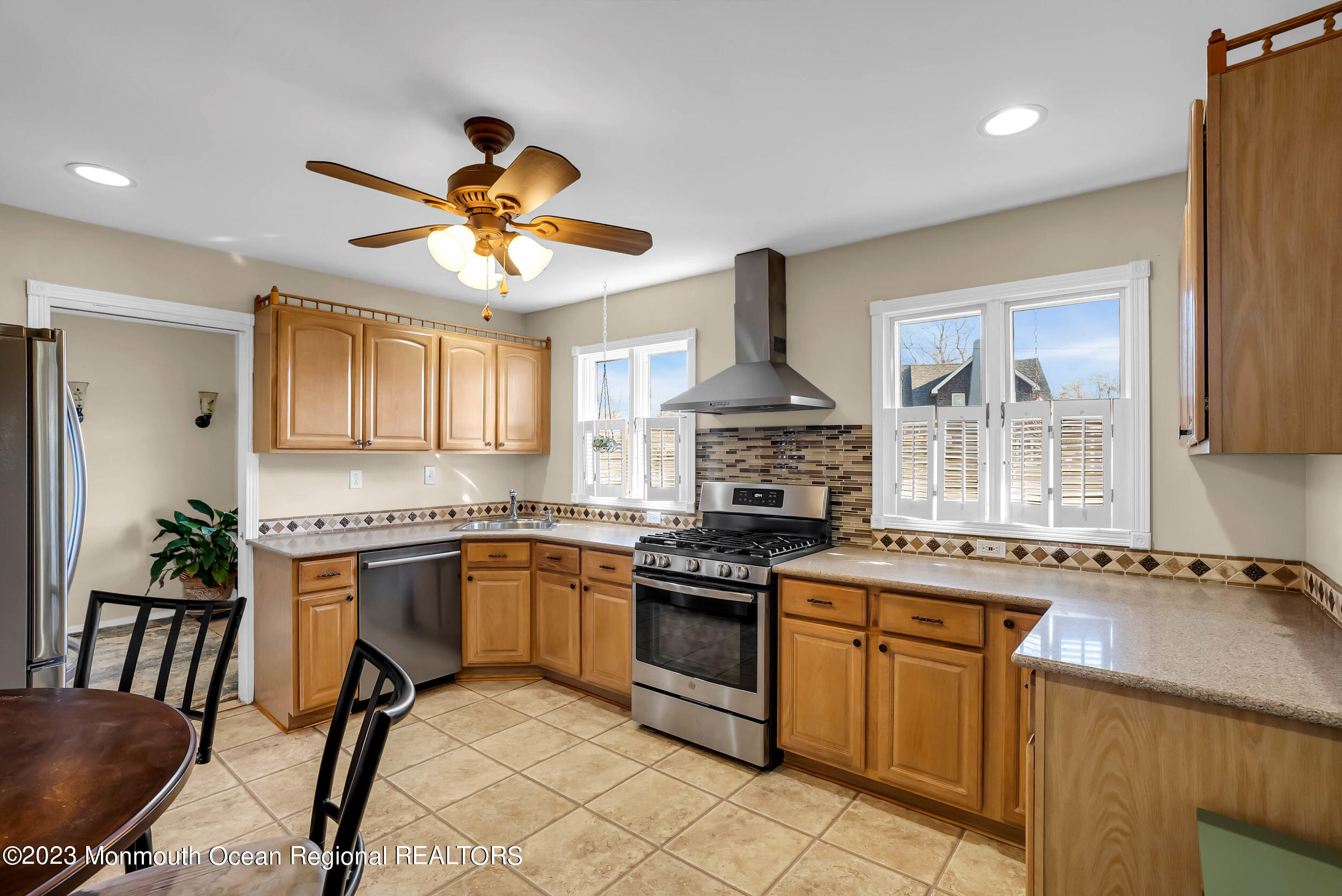 250 Cliftwood Road Oakhurst, NJ 07755 - Photo 4 of 40 a kitchen with stainless steel appliances a stove a sink and a refrigerator