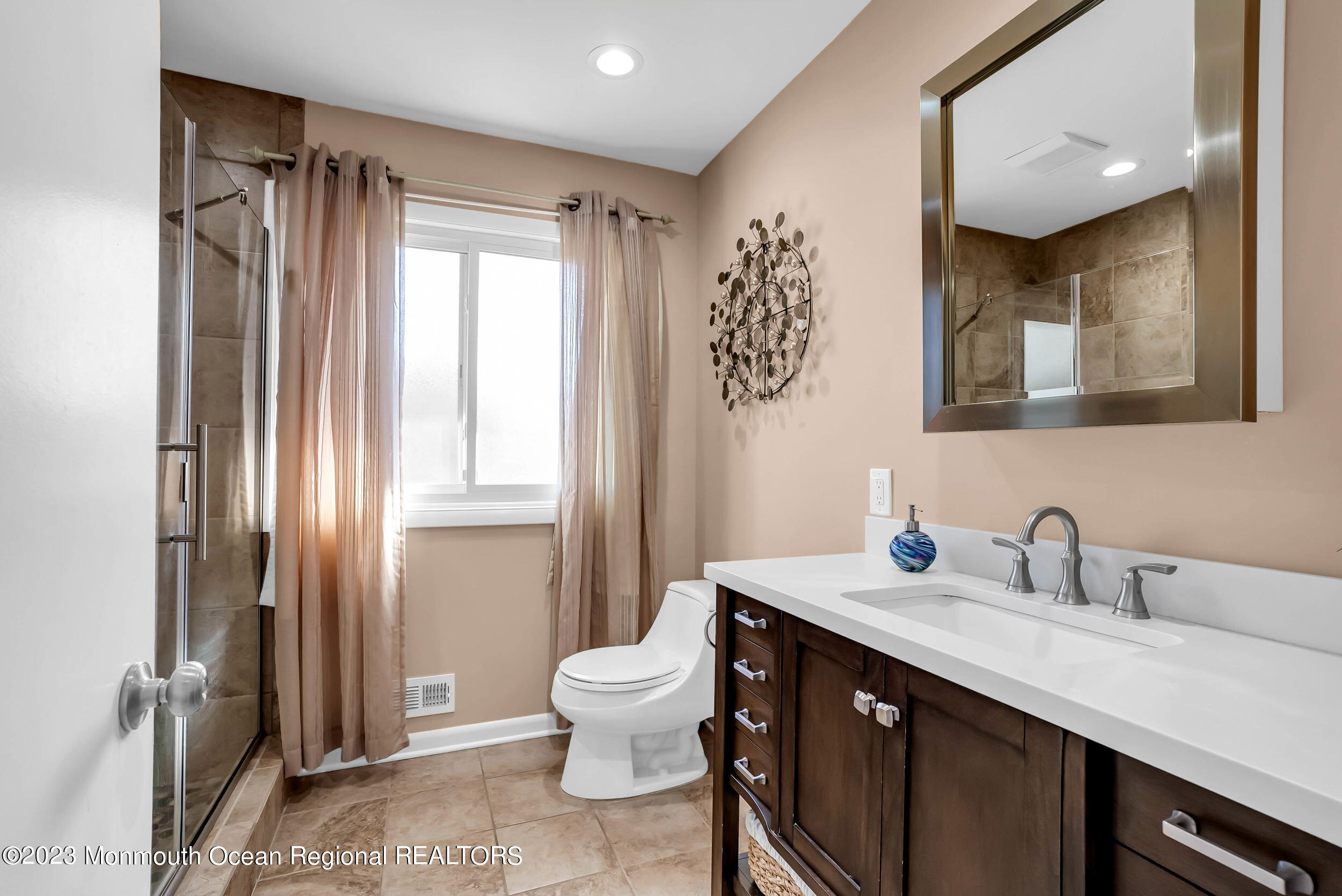 250 Cliftwood Road Oakhurst, NJ 07755 - Photo 8 of 40 a bathroom with a sink and a mirror