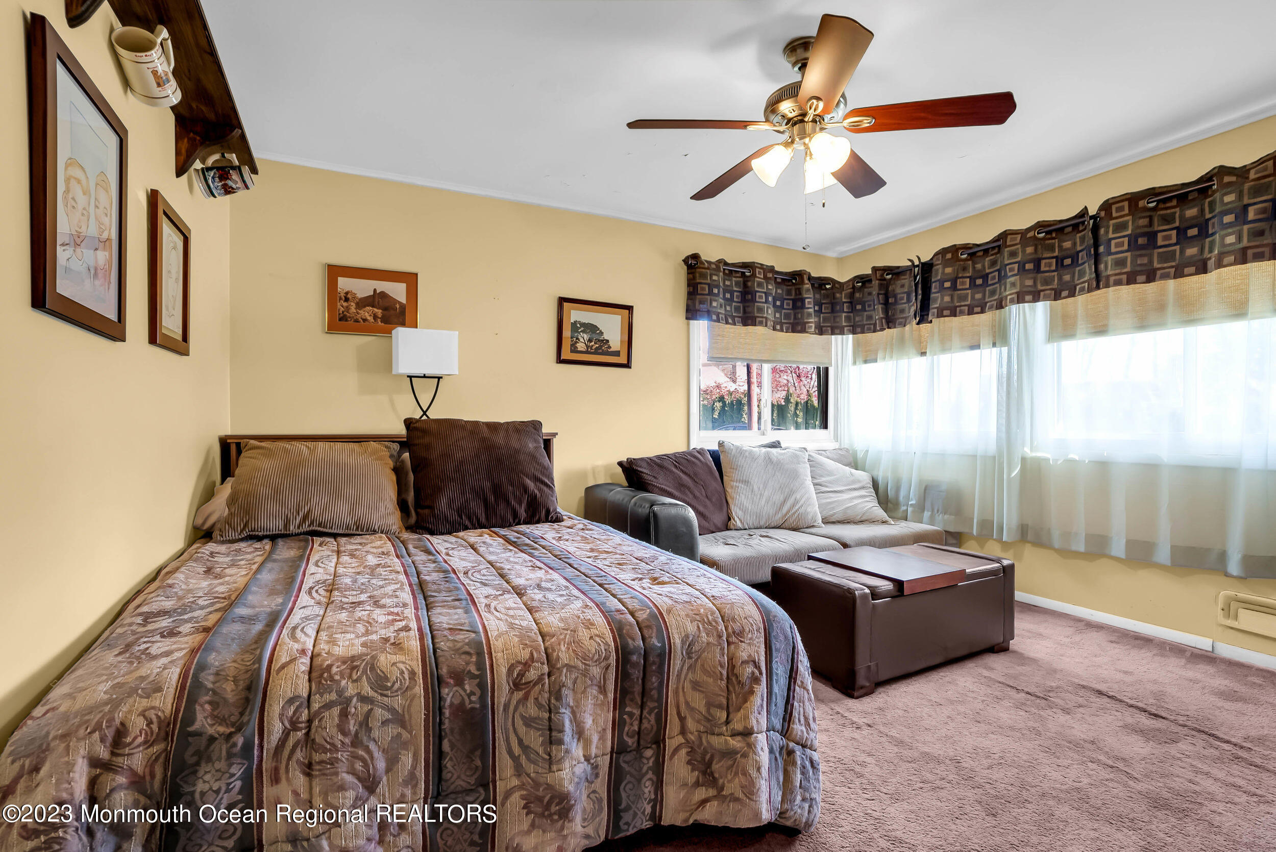 250 Cliftwood Road Oakhurst, NJ 07755 - Photo 10 of 40 a bedroom with two beds and a chandelier