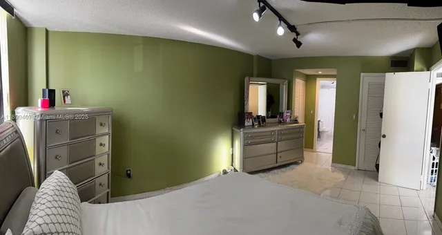 a room with a bed and furniture