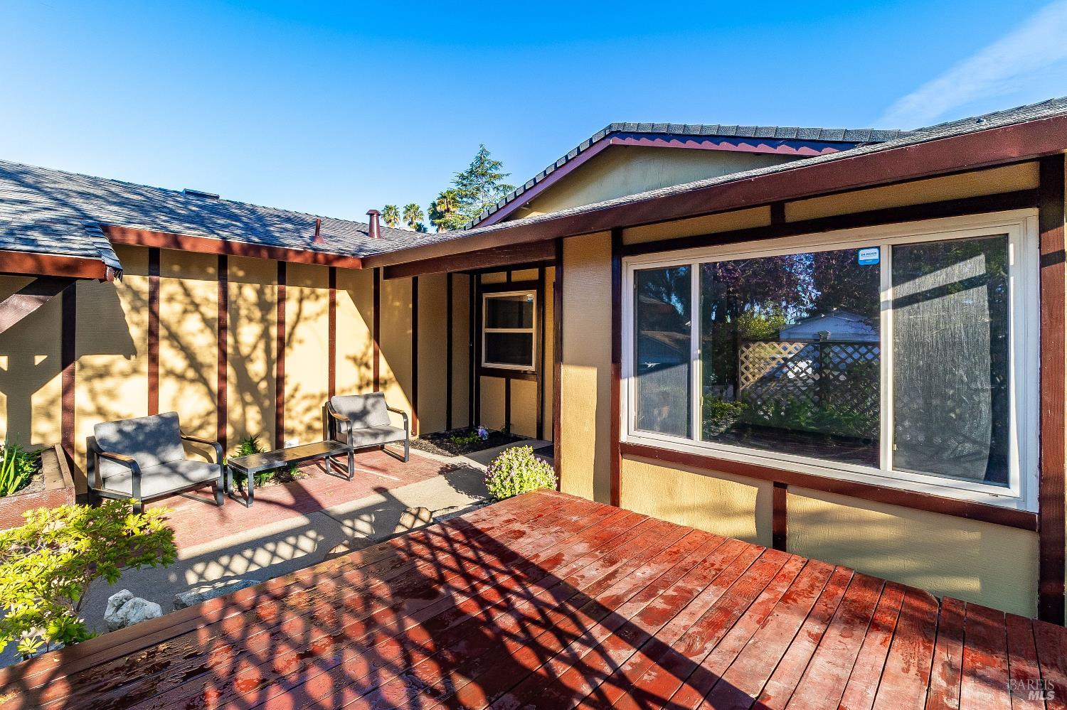 900 Seascape Circle Rodeo, CA 94572 - Photo 17 of 54 a bedroom with a bed and large windows