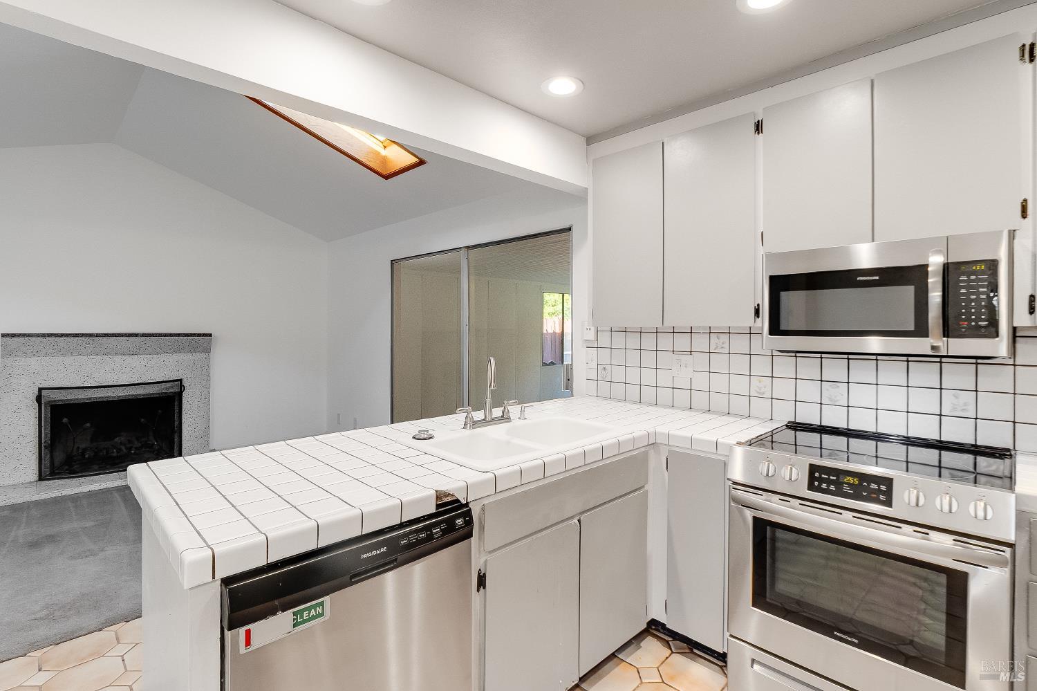 900 Seascape Circle Rodeo, CA 94572 - Photo 23 of 54 a kitchen with a stove microwave and a sink