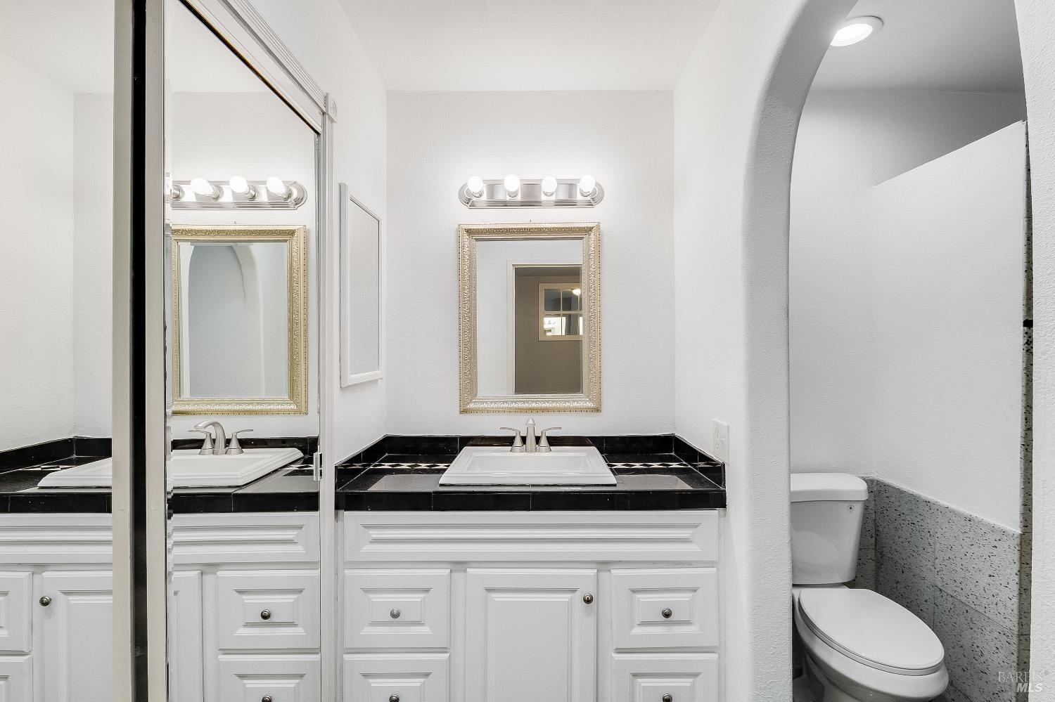 900 Seascape Circle Rodeo, CA 94572 - Photo 33 of 54 a bathroom with a toilet a sink and a mirror