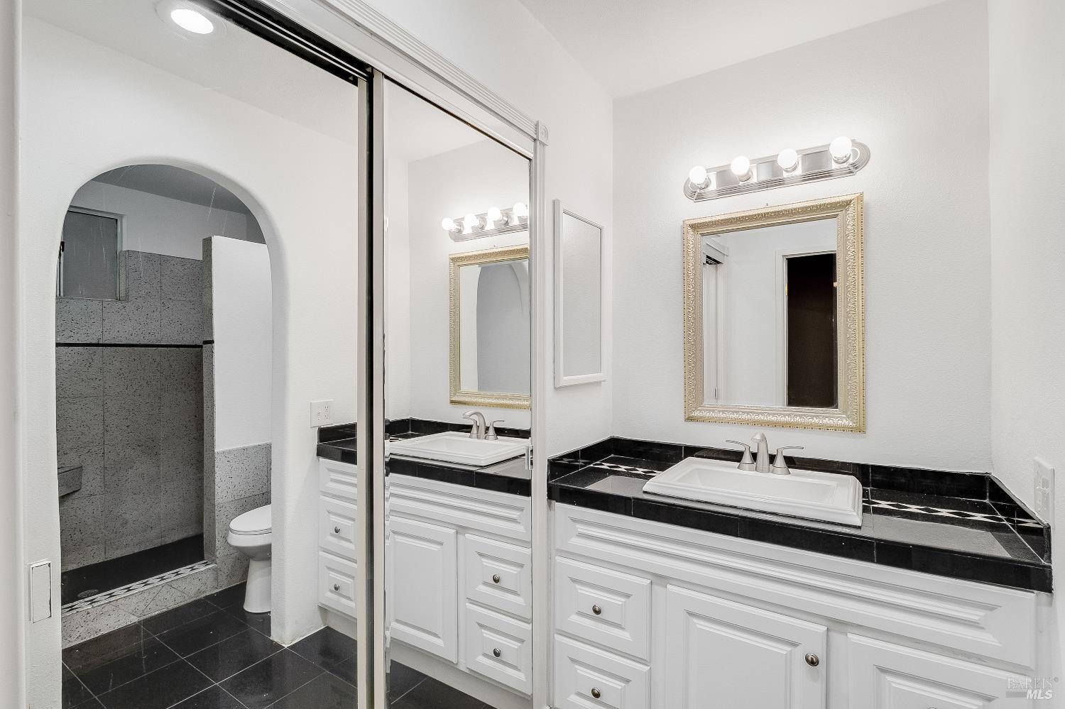 900 Seascape Circle Rodeo, CA 94572 - Photo 34 of 54 a bathroom with a sink a toilet and a mirror