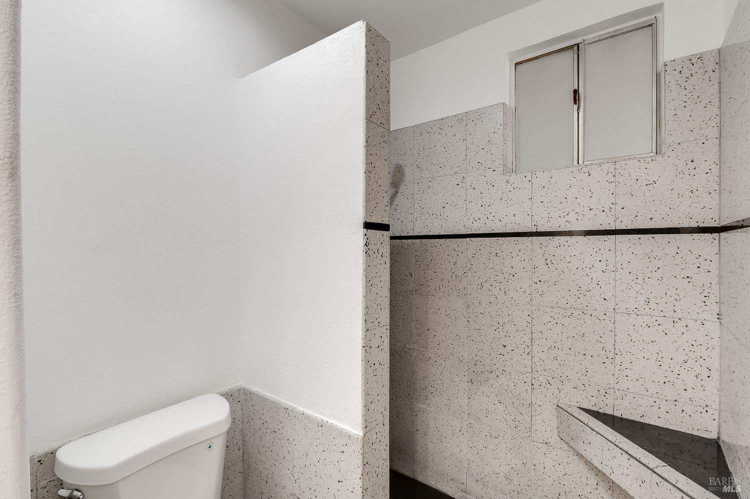 900 Seascape Circle Rodeo, CA 94572 - Photo 35 of 54 a bathroom with a granite countertop toilet and a sink