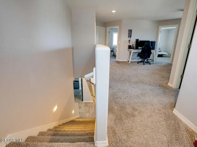 a lobby with furniture and rug