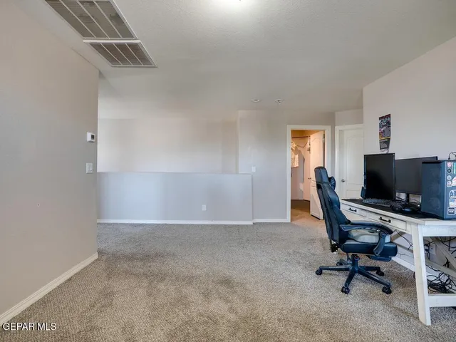 a view of workspace with livingroom view