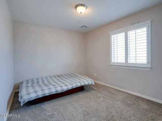 a room with a bed and a window