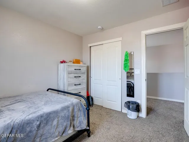 a bed room with a bed and a window