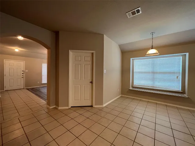 a view of an empty room with window