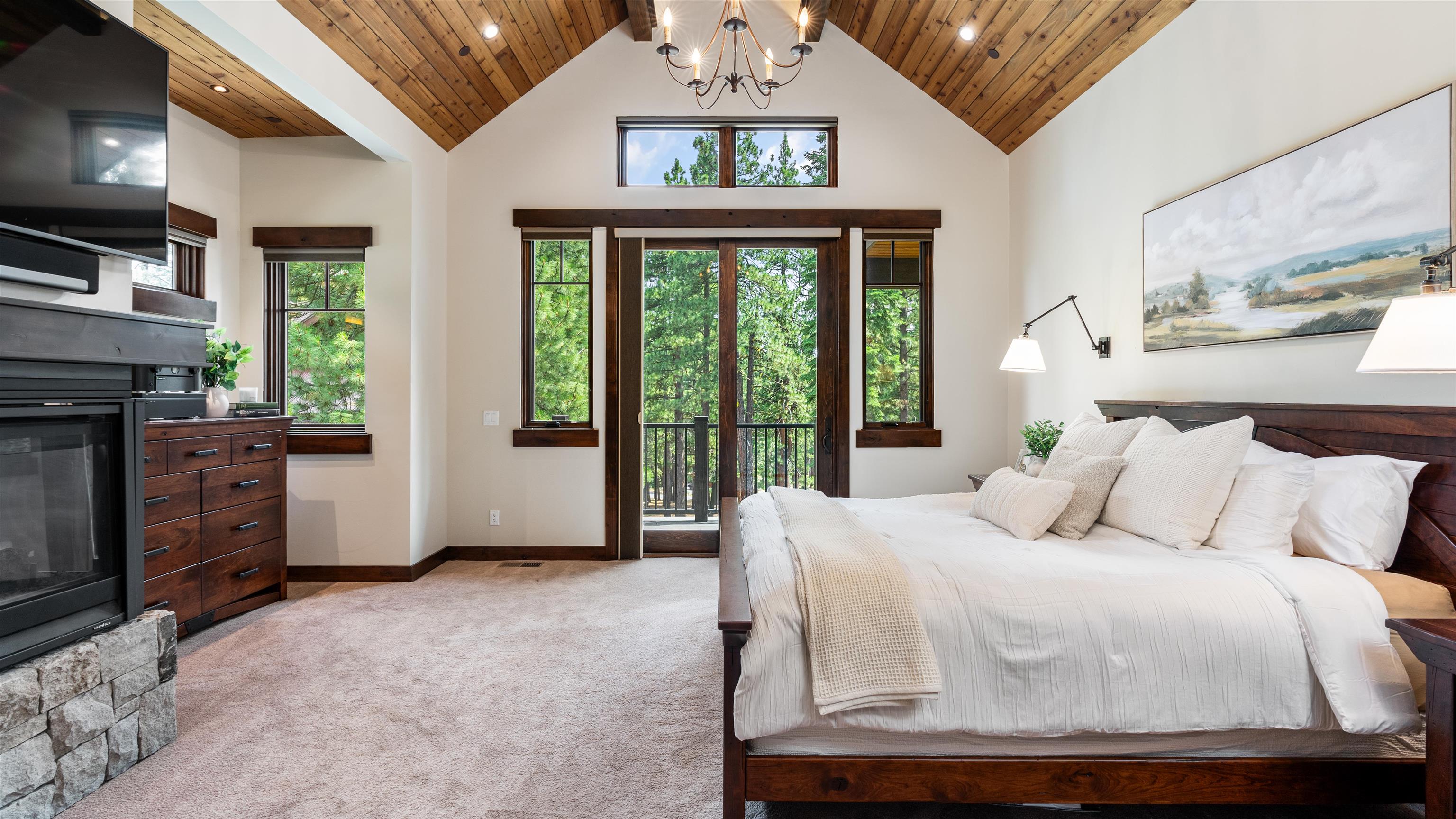 11660 China Camp Road Truckee, CA 96161 - Photo 13 of 21 a bedroom with a bed and large windows