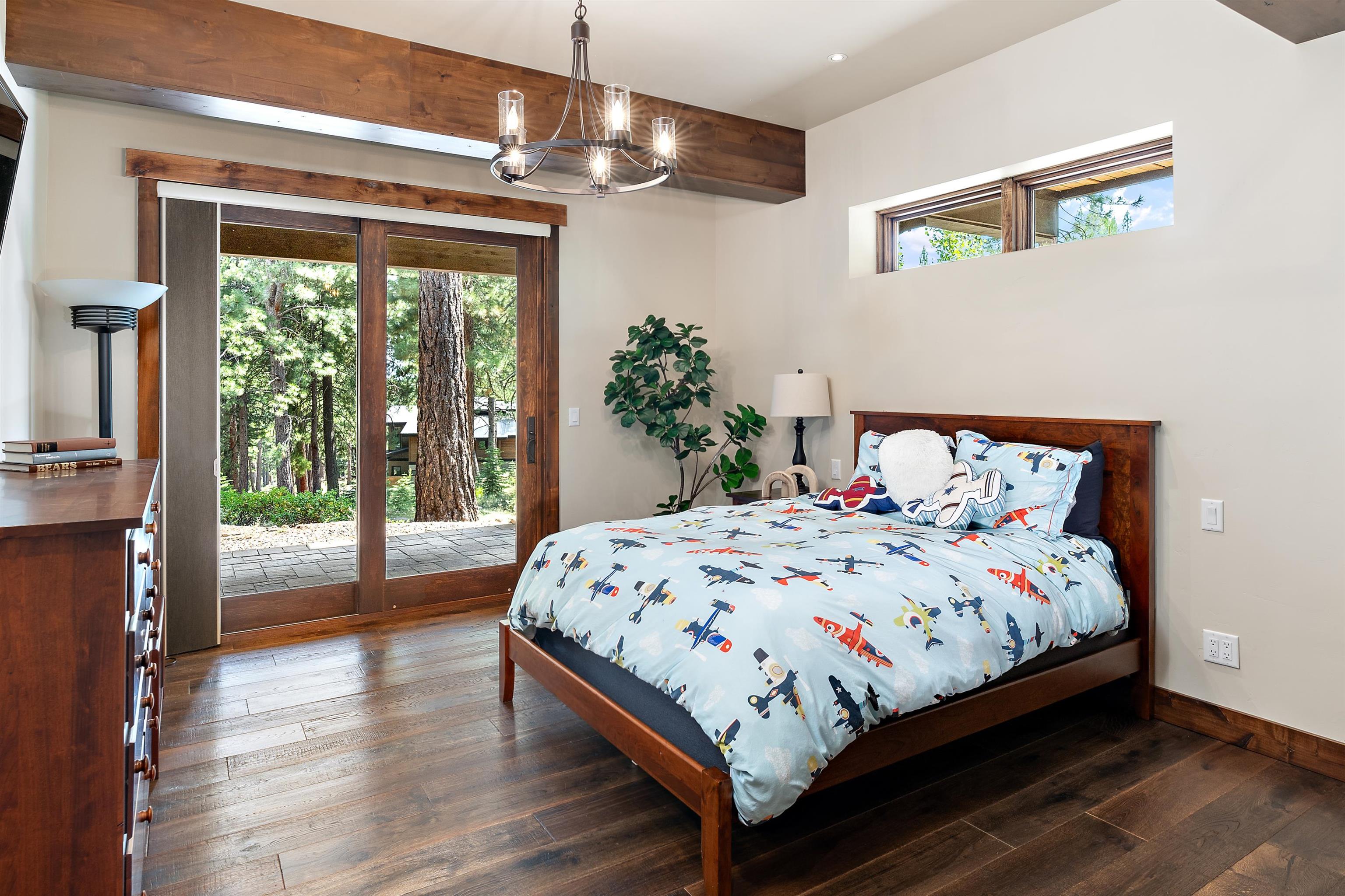 11660 China Camp Road Truckee, CA 96161 - Photo 20 of 21 a bedroom with a large bed and a large window