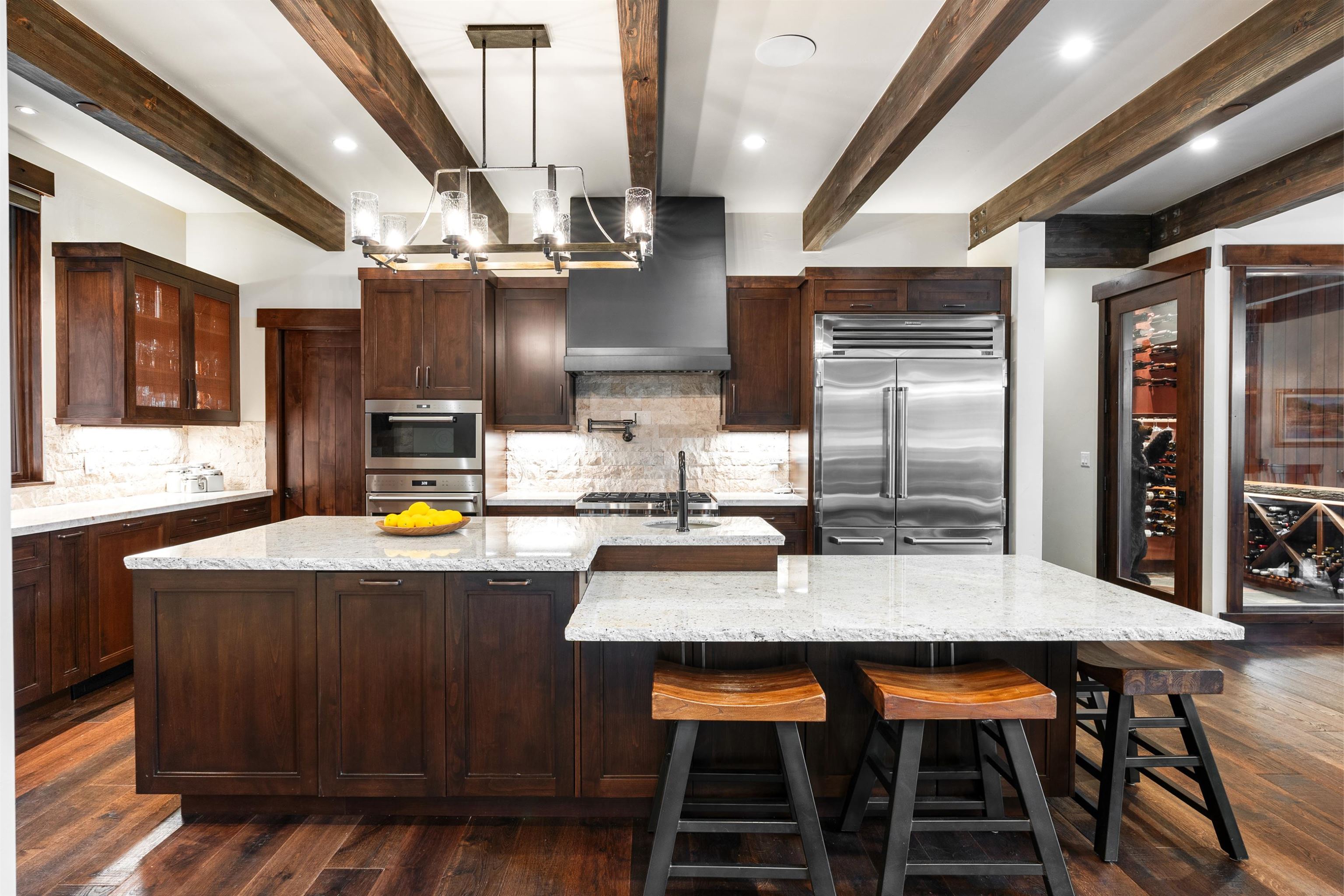 11660 China Camp Road Truckee, CA 96161 - Photo 5 of 21 a kitchen with granite countertop a table chairs a stove and a refrigerator