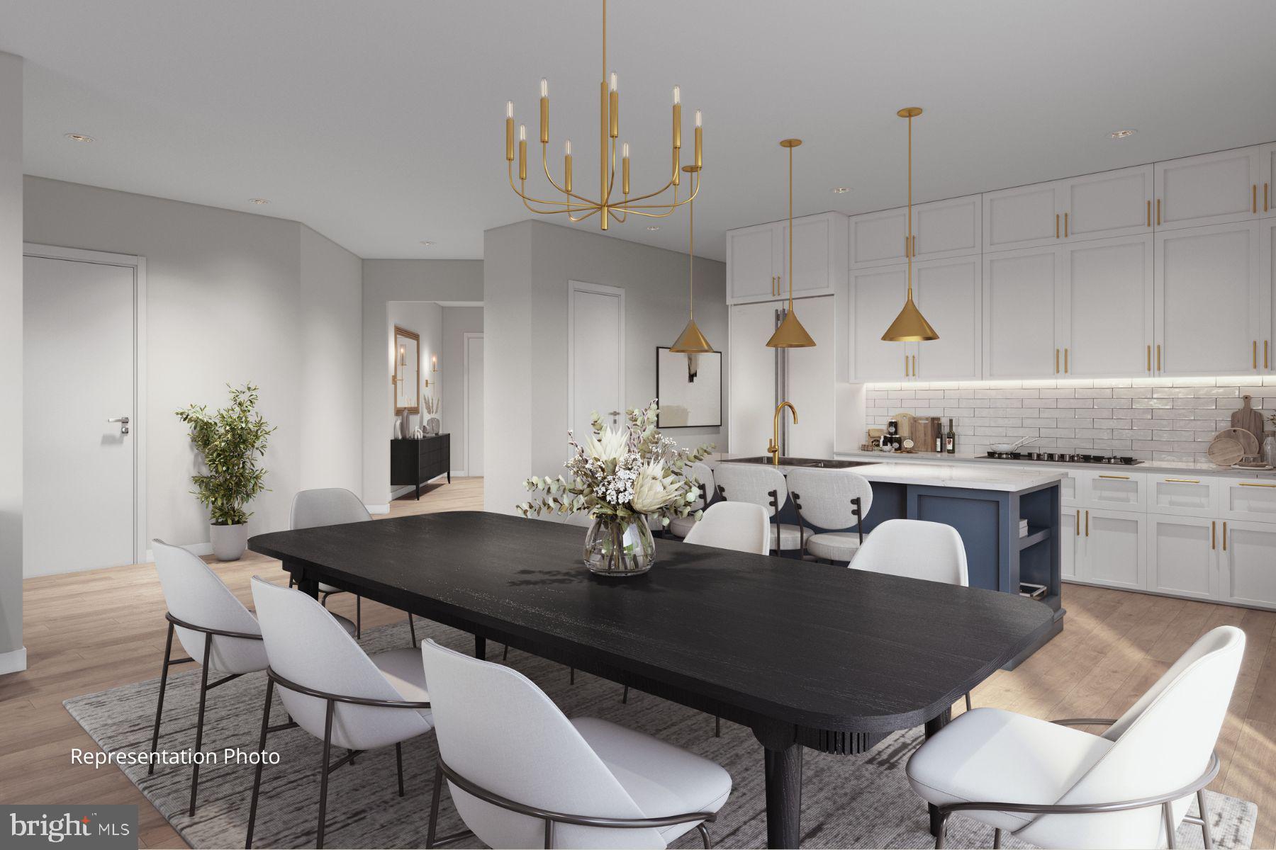 117 Blackford Boulevard, Unit 205 Lebanon, PA 17042 - Photo 4 of 10 a kitchen with granite countertop a table chairs stove and view living room