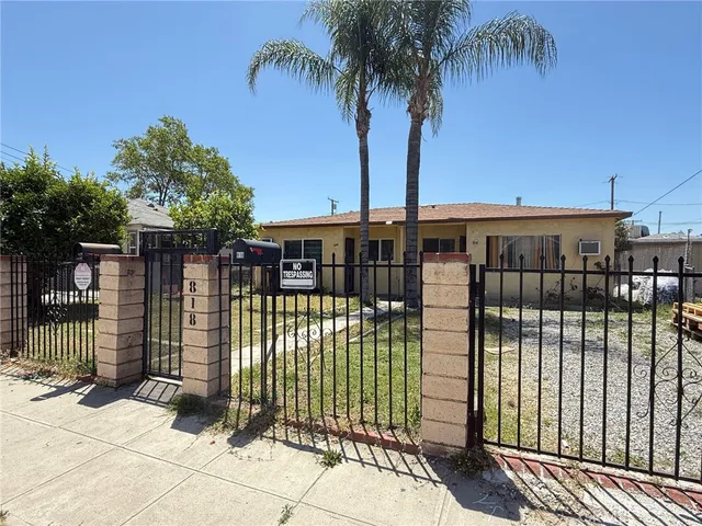 a view of a wrought iron fences in front of house