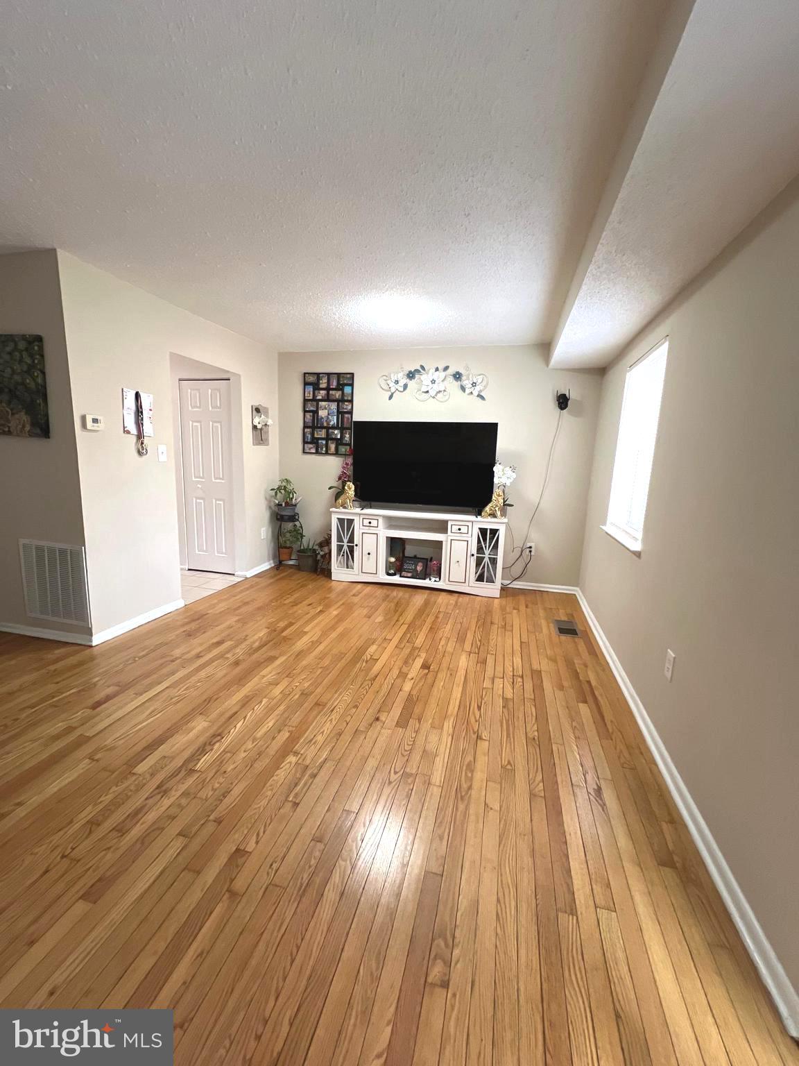 1132 West Side Drive, Unit 32B Gaithersburg, MD 20878 - Photo 12 of 51 a view of livingroom with wooden floor and a sink