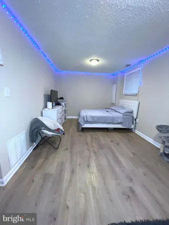 a bedroom with bed and window
