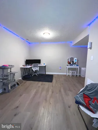 a room with furniture and a wooden floor