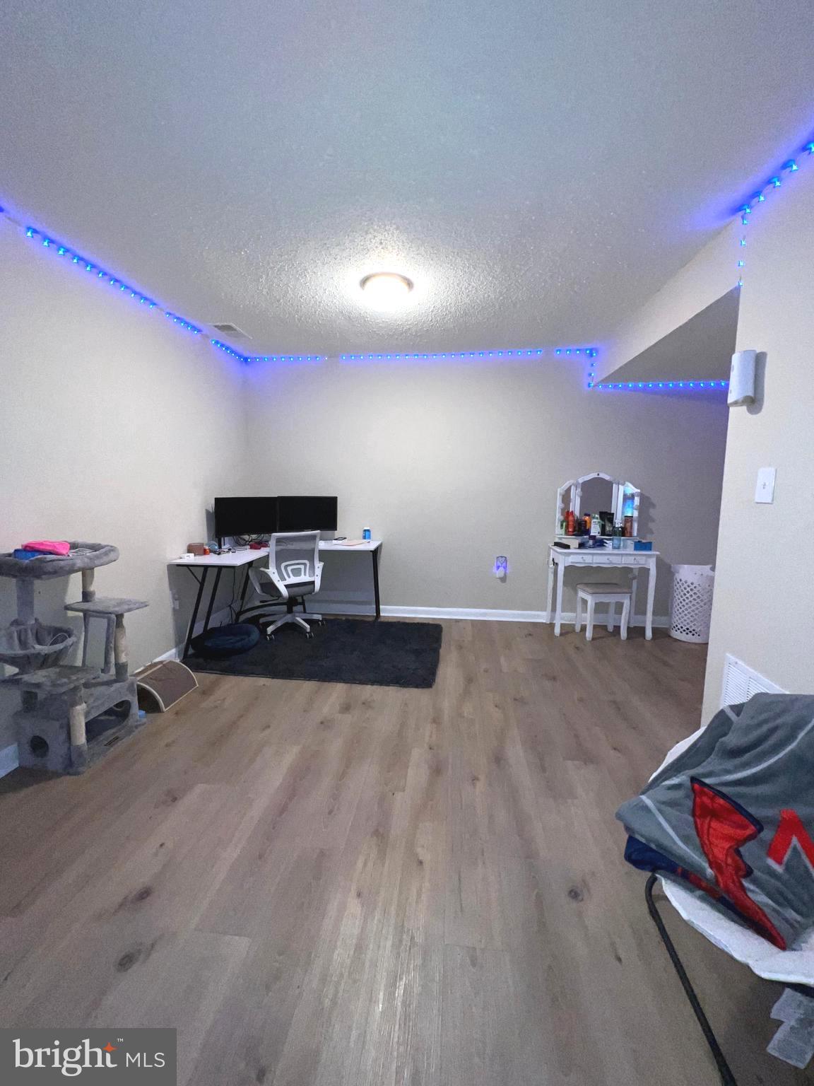 1132 West Side Drive, Unit 32B Gaithersburg, MD 20878 - Photo 26 of 51 a room with furniture and a wooden floor