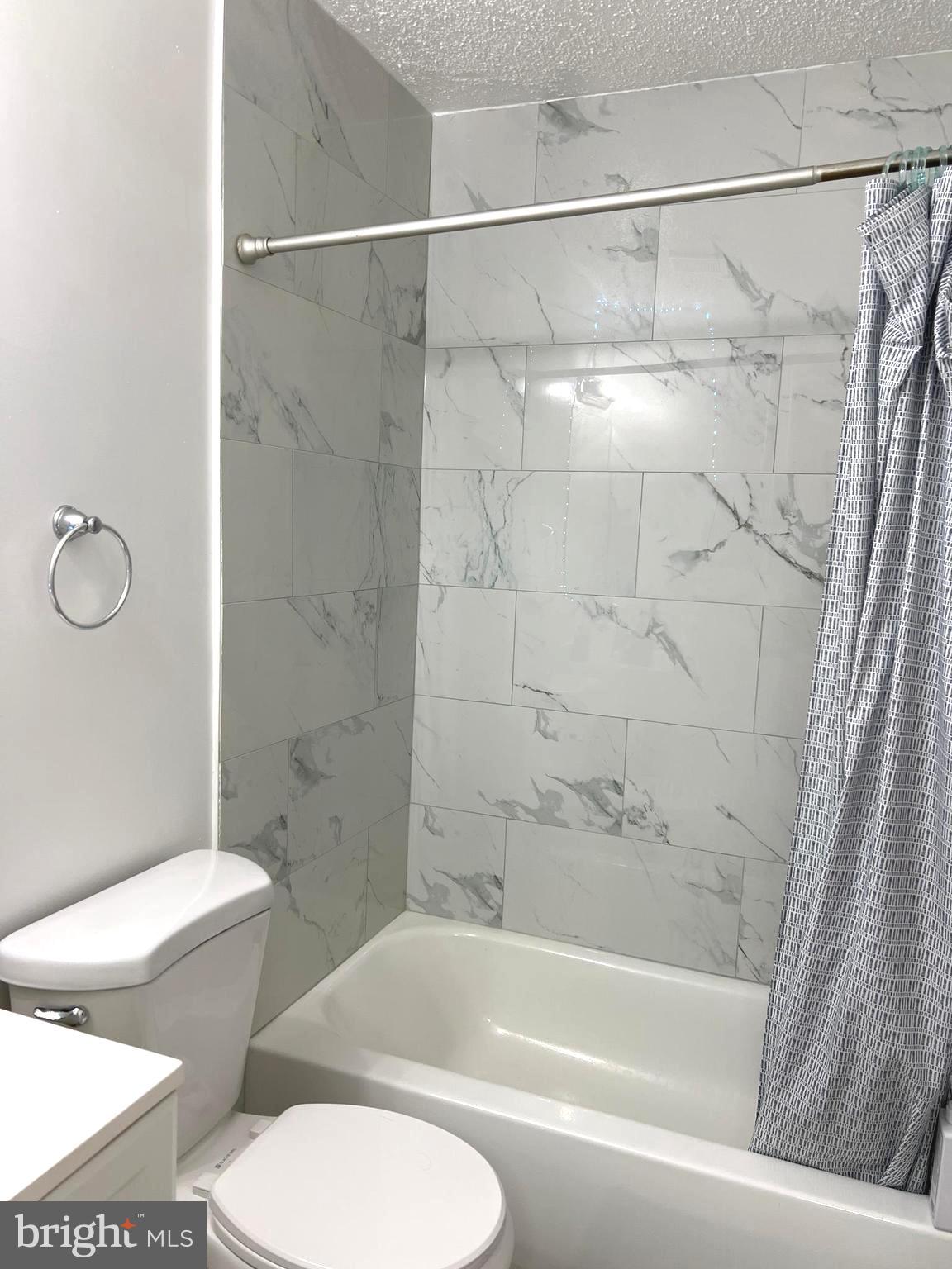 1132 West Side Drive, Unit 32B Gaithersburg, MD 20878 - Photo 31 of 51 a bathroom with a toilet and a bathtub