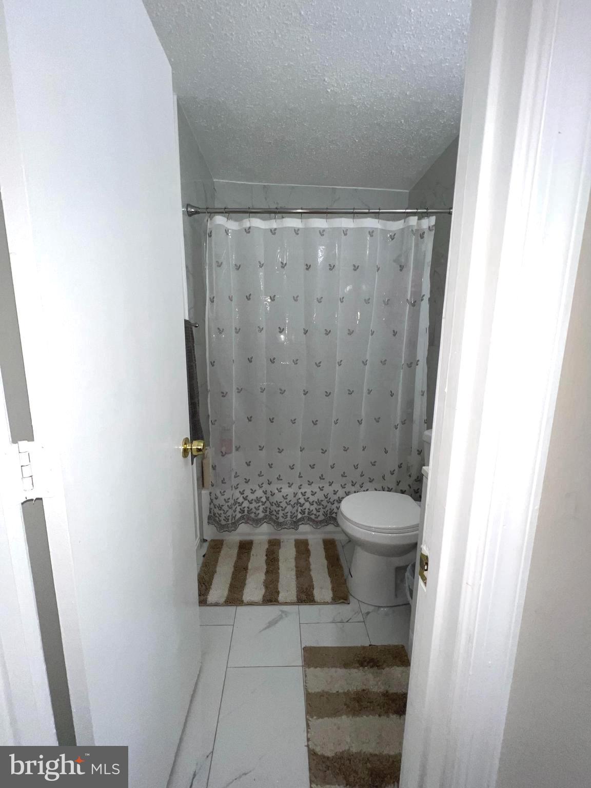 1132 West Side Drive, Unit 32B Gaithersburg, MD 20878 - Photo 44 of 51 a bathroom with a sink a toilet and a shower