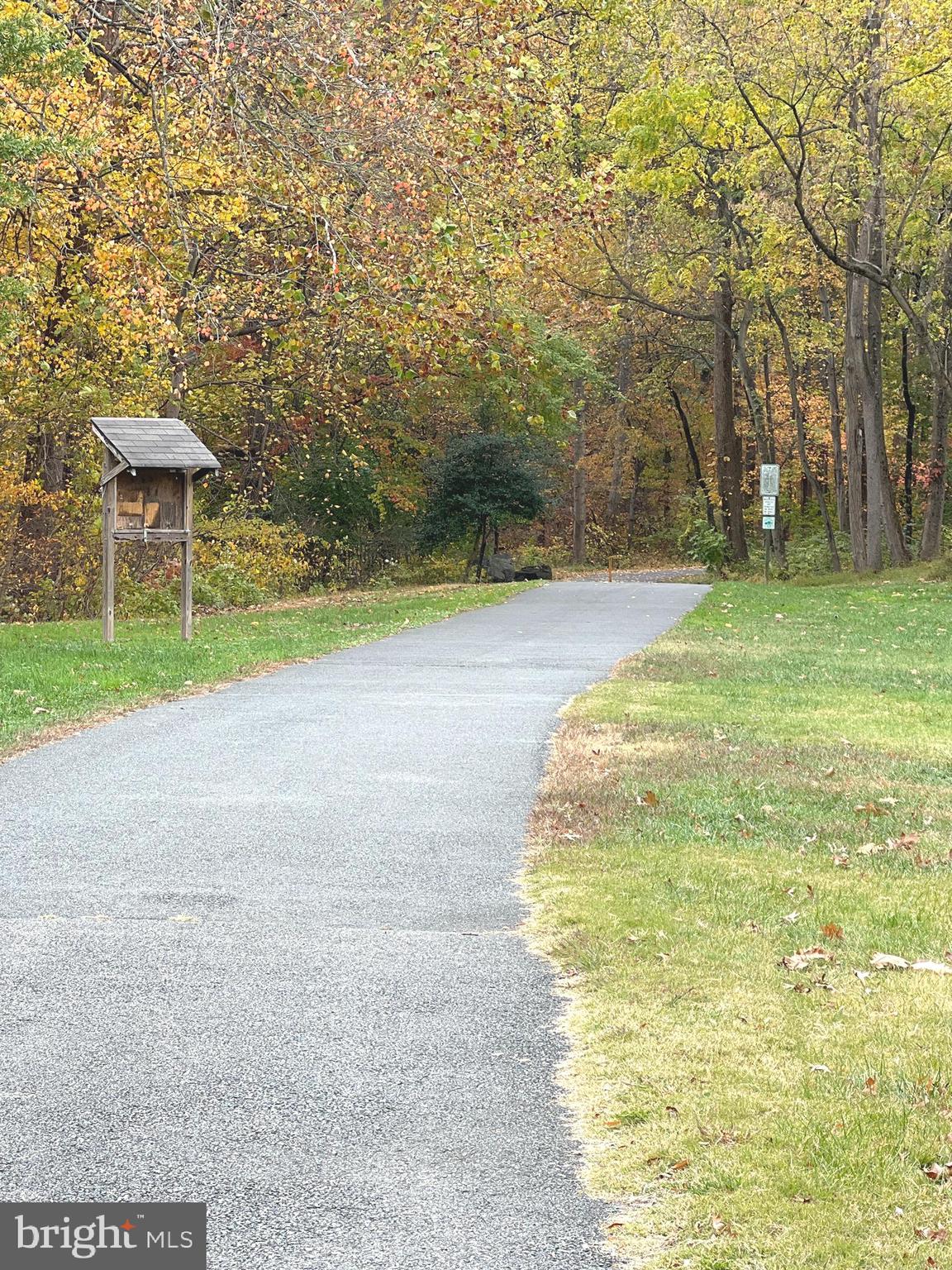 1132 West Side Drive, Unit 32B Gaithersburg, MD 20878 - Photo 50 of 51 a swimming pool with a yard and trees