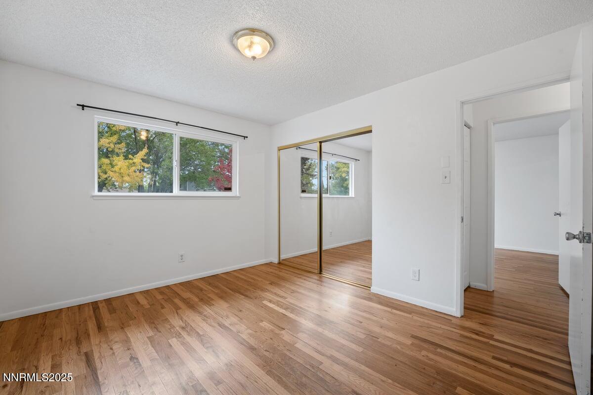 1421 Surf Way Reno, NV 89503 - Photo 17 of 30 a view of empty room with wooden floor and fan