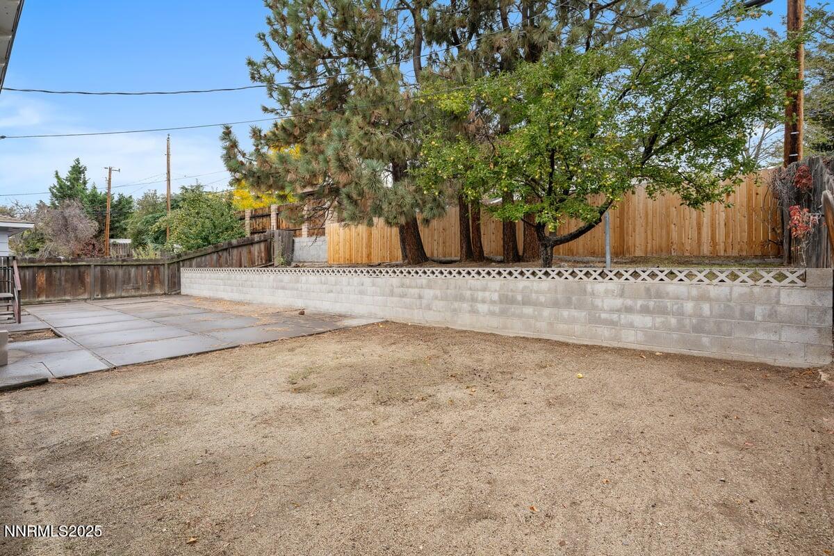 1421 Surf Way Reno, NV 89503 - Photo 28 of 30 a view of a backyard with large trees