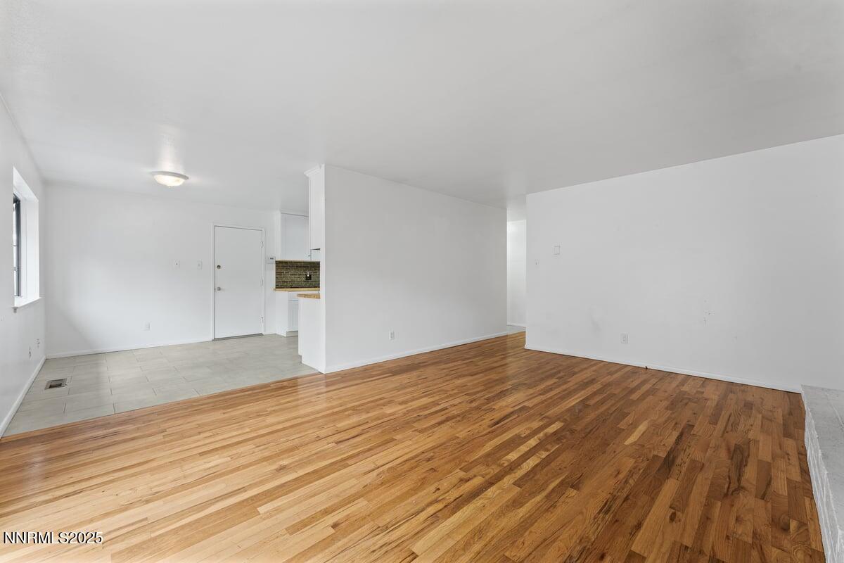 1421 Surf Way Reno, NV 89503 - Photo 8 of 30 a view of empty room with wooden floor