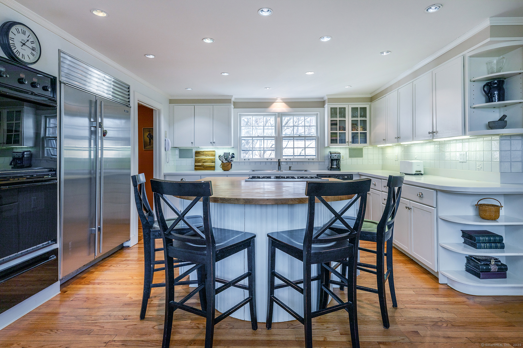 196 Baldwin Hill Road Washington, CT 06777 - Photo 15 of 28 a kitchen with stainless steel appliances kitchen island granite countertop a dining table chairs and granite counter tops