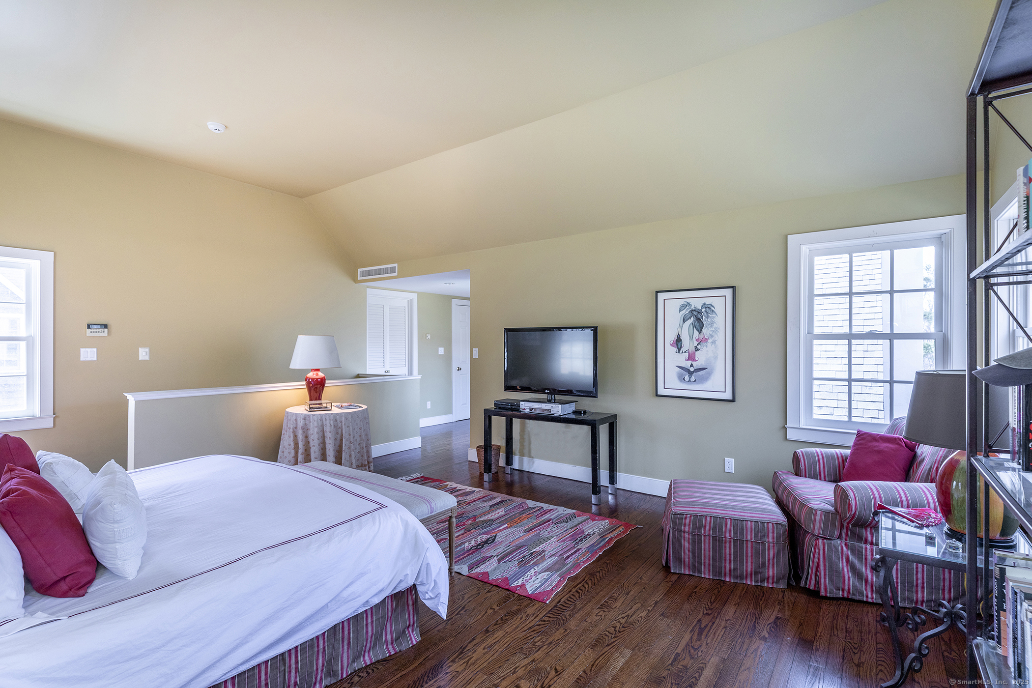 196 Baldwin Hill Road Washington, CT 06777 - Photo 19 of 28 a bedroom with furniture and a flat screen tv