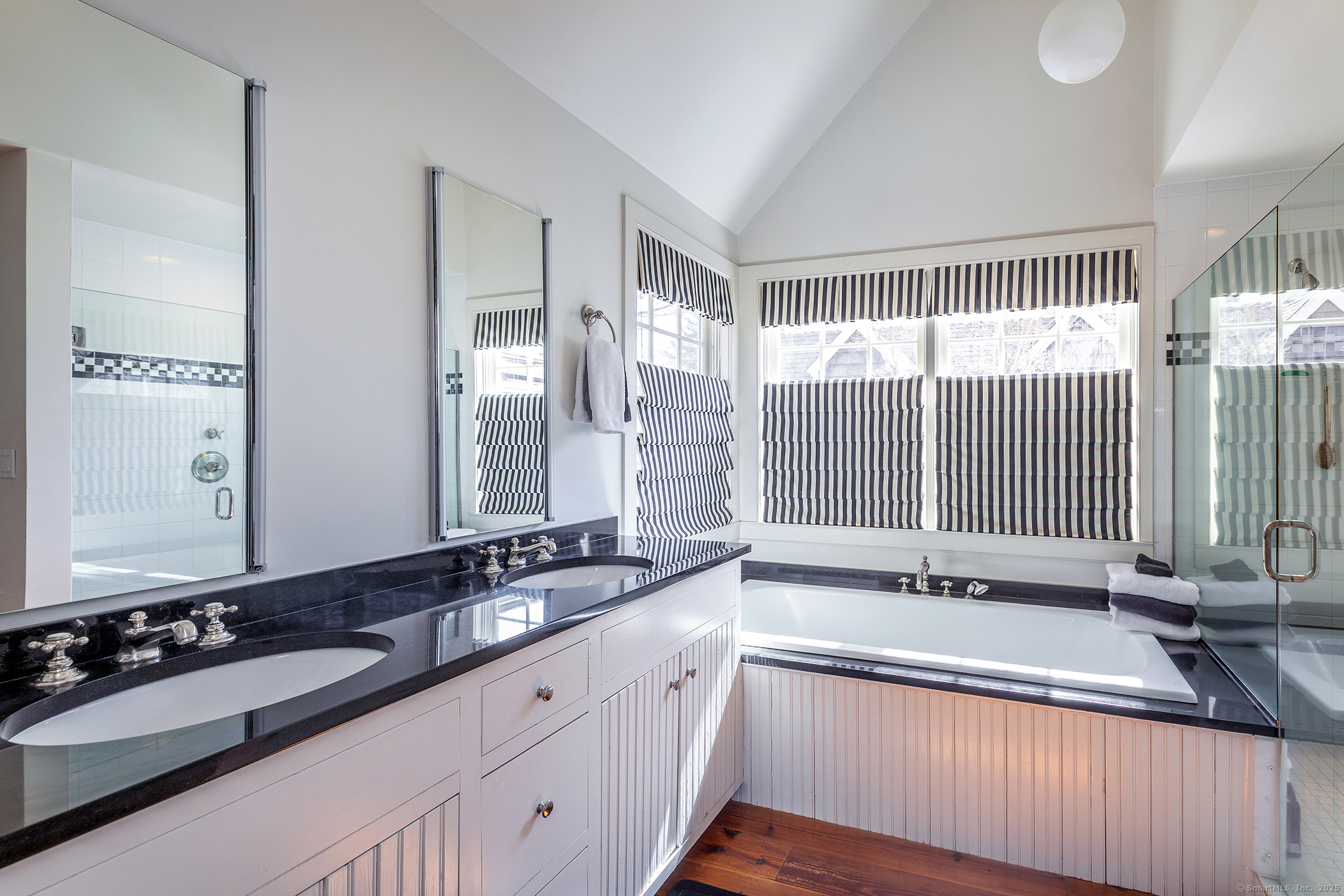 196 Baldwin Hill Road Washington, CT 06777 - Photo 20 of 28 a spacious bathroom with a double vanity sink and mirror