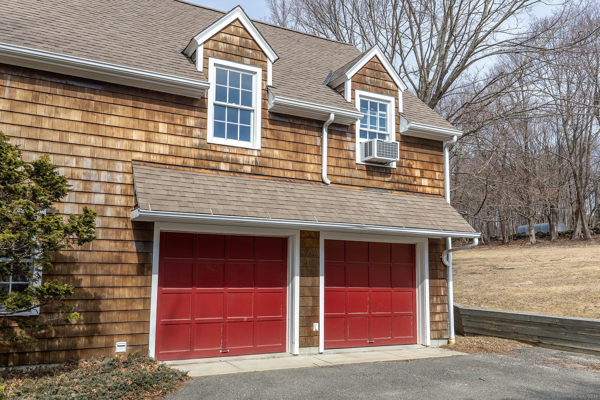 196 Baldwin Hill Road Washington, CT 06777 - Photo 25 of 28 a front view of a house with a yard