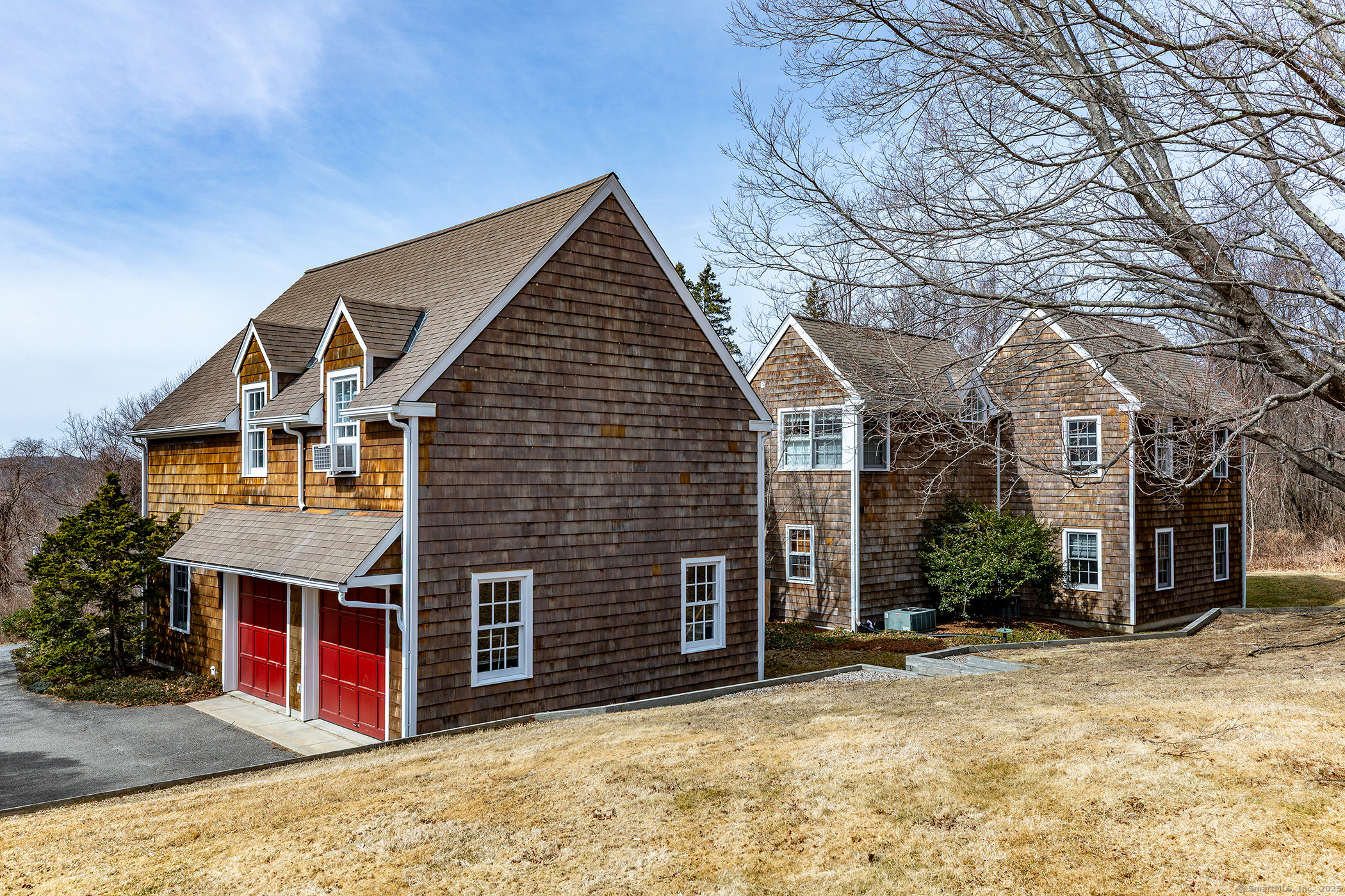 196 Baldwin Hill Road Washington, CT 06777 - Photo 26 of 28 a view of a house with a yard and garage