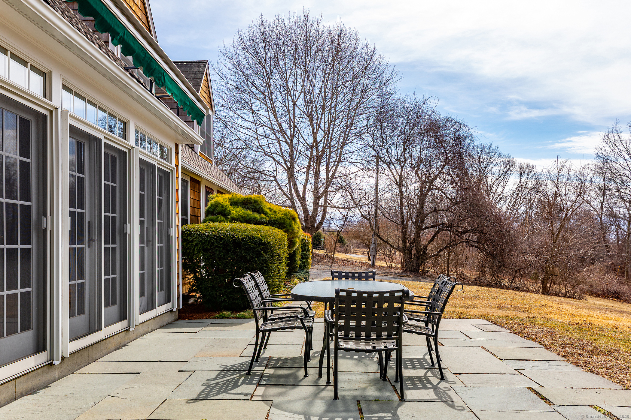 196 Baldwin Hill Road Washington, CT 06777 - Photo 7 of 28 a view of a chairs and table in the patio