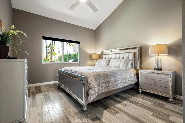 a bedroom with a bed and a chair