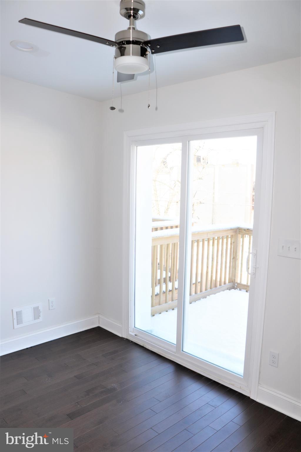 2040 East Preston Street Baltimore, MD 21213 - Photo 14 of 16 Second Bedroom with deck and bathroom