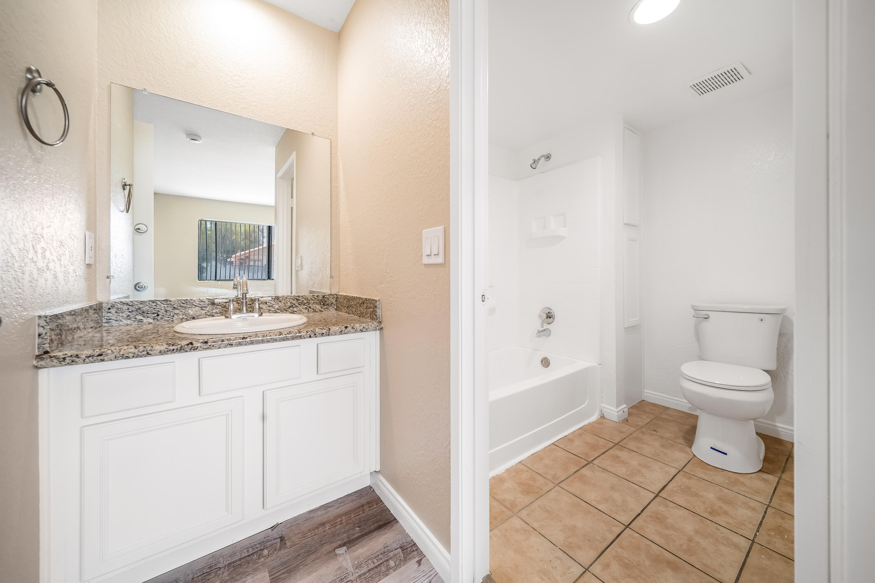 78650 Ave 42, Unit 1407 Bermuda Dunes, CA 92203 - Photo 13 of 20 a bathroom with a granite countertop sink toilet and shower