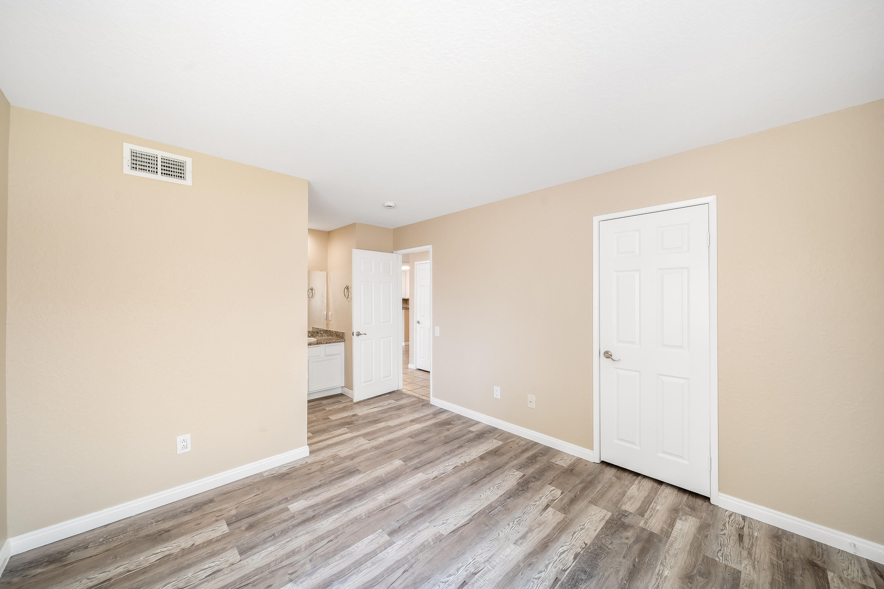 78650 Ave 42, Unit 1407 Bermuda Dunes, CA 92203 - Photo 15 of 20 a view of a room with wooden floor