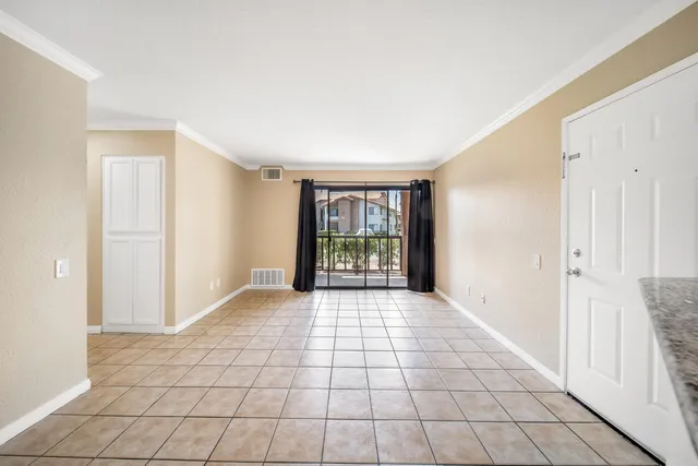 a view of an empty room with windows