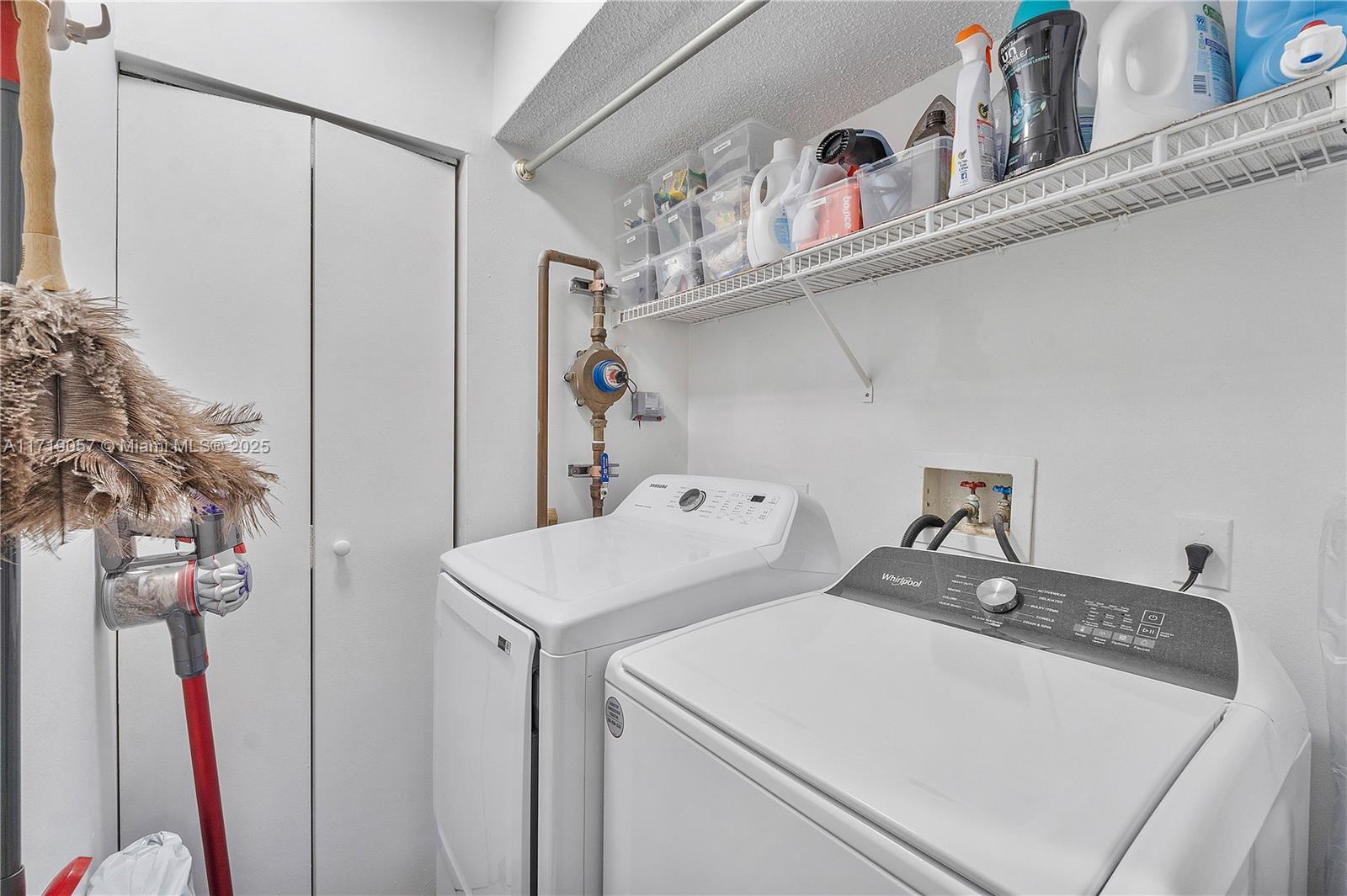 8871 Wiles Road, Unit 204 Coral Springs, FL 33067 - Photo 21 of 25 a utility room with dryer and washer