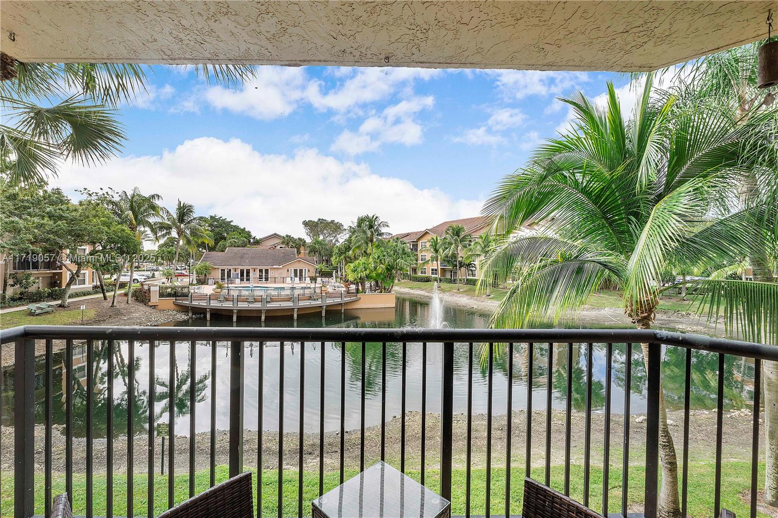 8871 Wiles Road, Unit 204 Coral Springs, FL 33067 - Photo 22 of 25 a view of a balcony with lake view