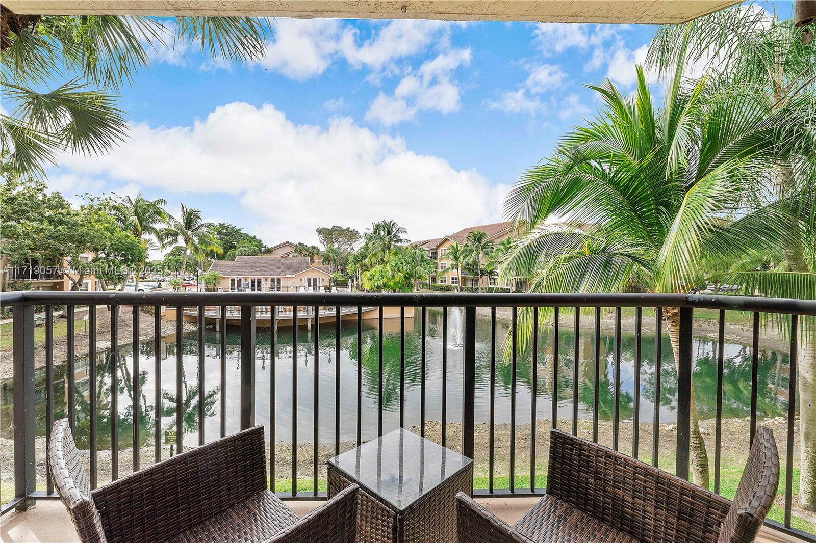 8871 Wiles Road, Unit 204 Coral Springs, FL 33067 - Photo 23 of 25 a view of a balcony with lake view