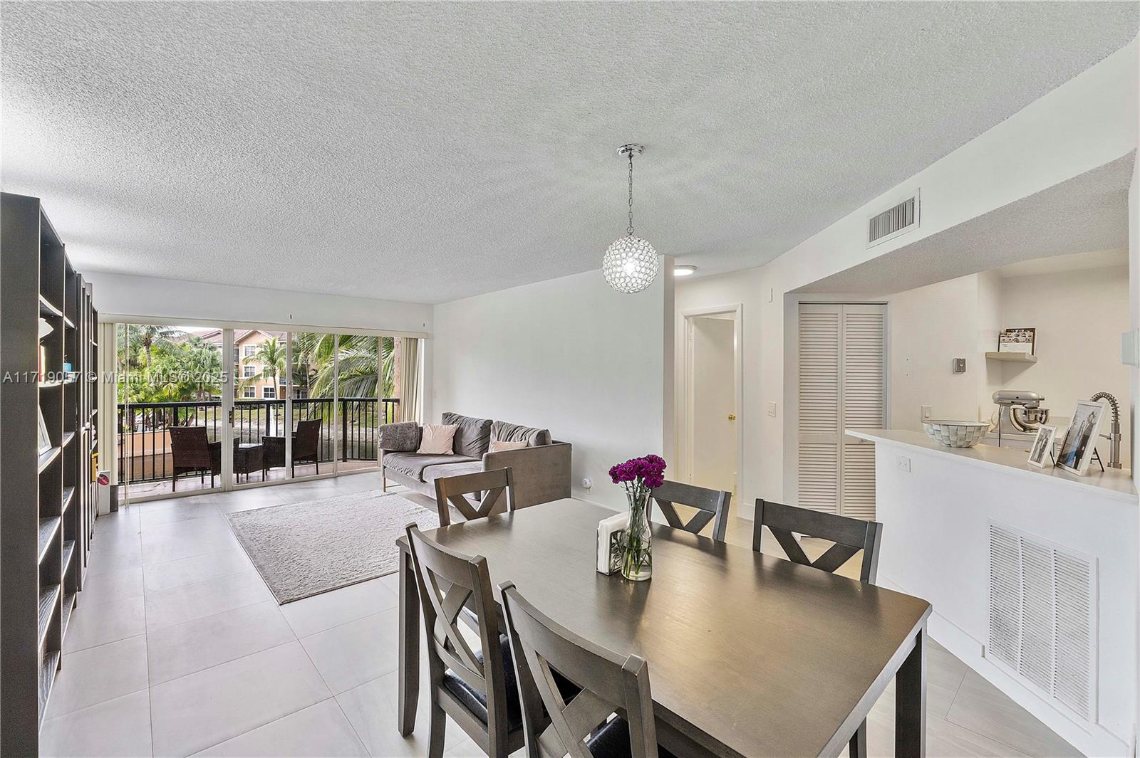 8871 Wiles Road, Unit 204 Coral Springs, FL 33067 - Photo 6 of 25 a view of a dining room with furniture window and outside view