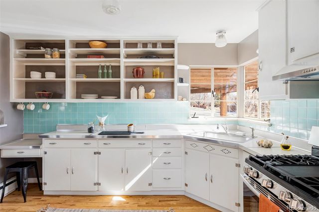 a kitchen with a sink and cabinets