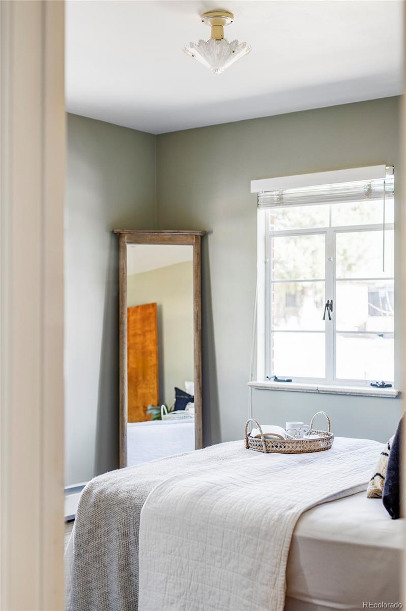 1201 Fairfax Street Denver, CO 80220 - Photo 18 of 40 a bedroom with a bed and a window